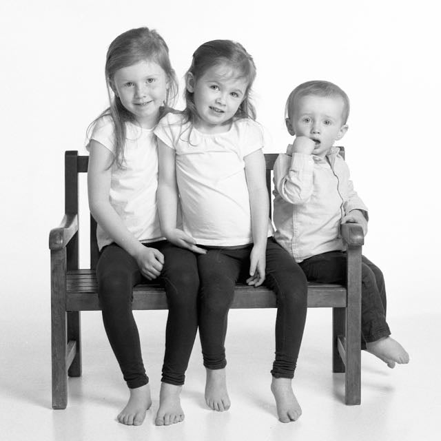Portrait of three young children in black & white by PHOTOGENIC Dalkey