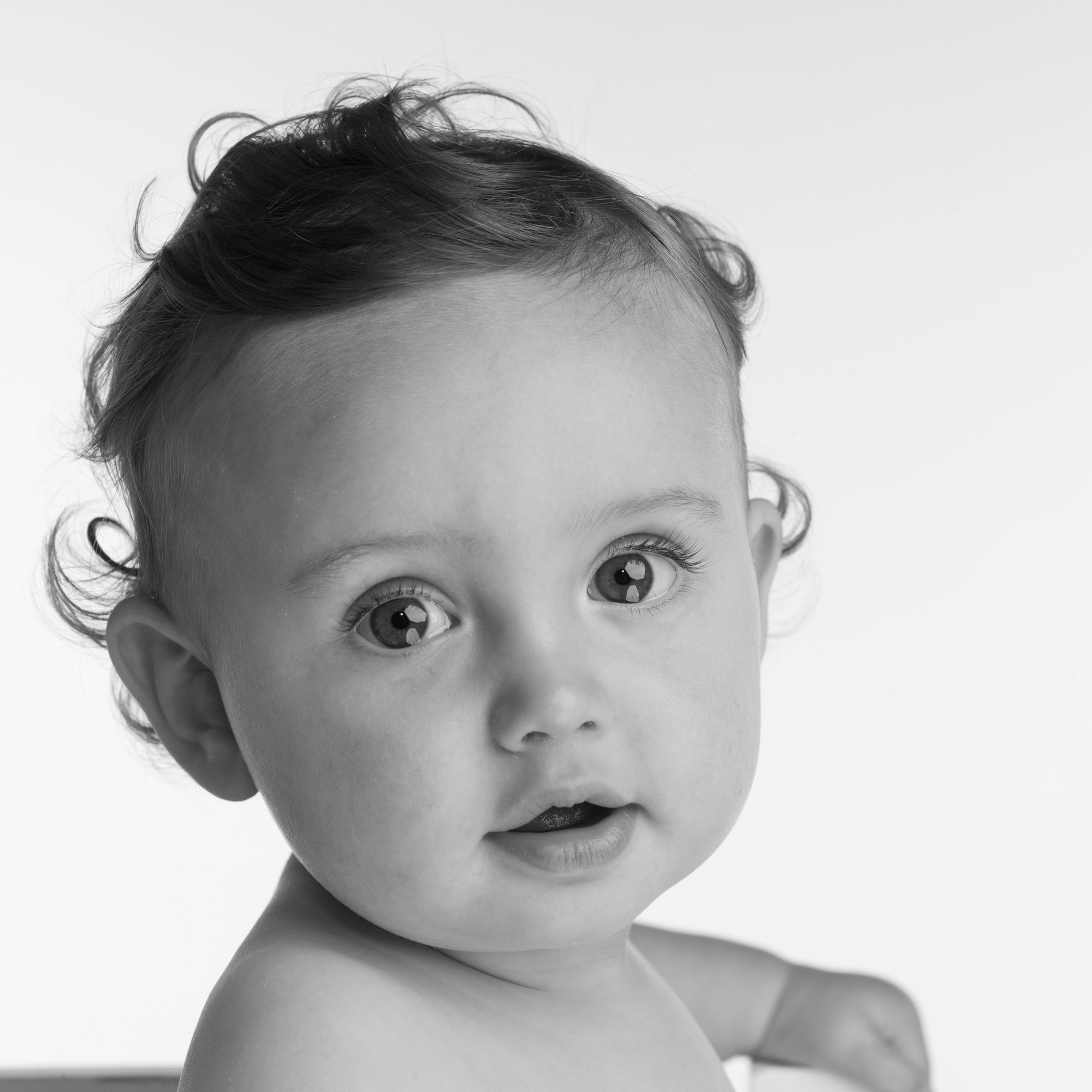 Close up of a baby boy's face by PHOTOGENIC Dalkey