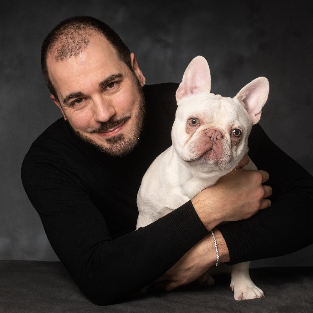 Colour Portrait of a man dressed in a black top with his white French Bulldog by PHOTOGENIC Dalkey