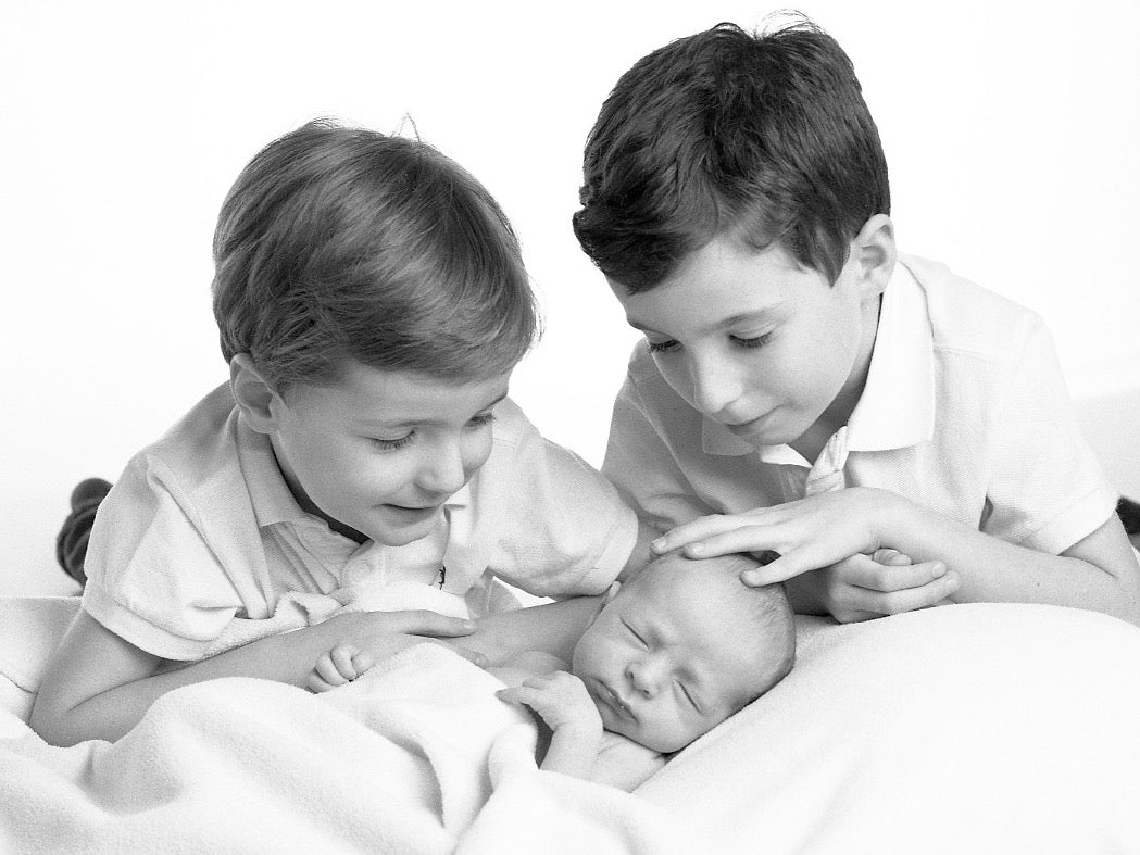 Newborn baby with his brothers Portrait by PHOTOGENIC Photographers 