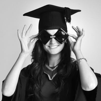 Fun Graduation Portrait of a young woman in black and white by PHOTOGENIC Dalkey